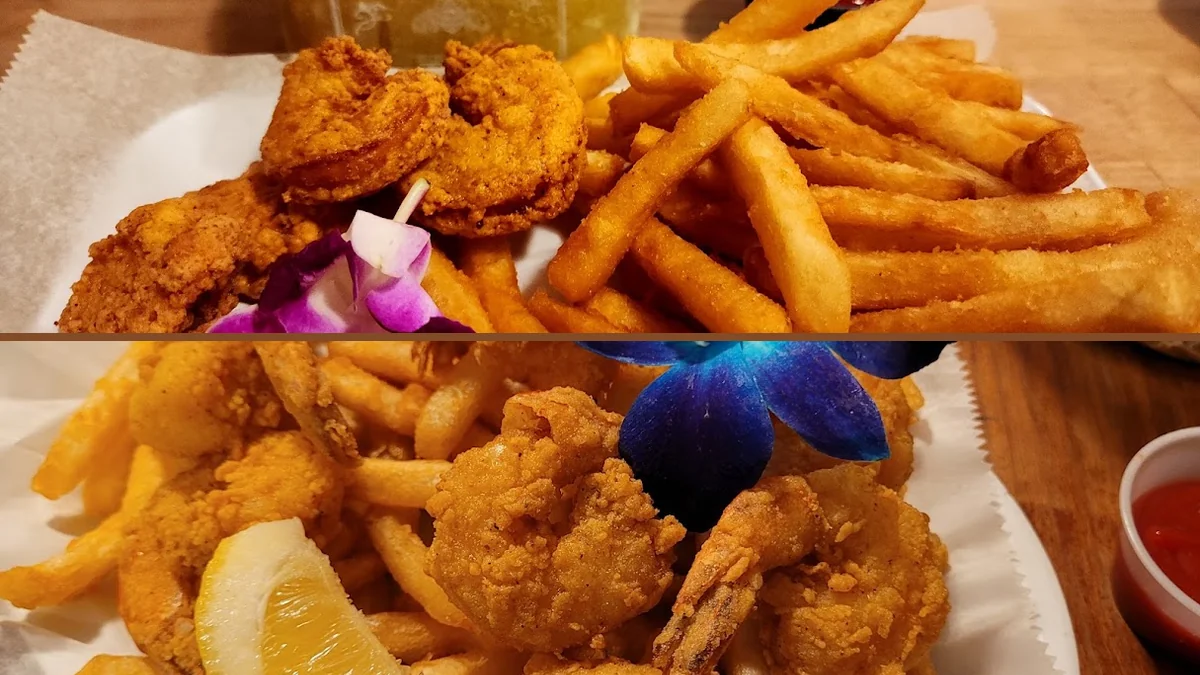 Shared seafood dishes beside drinks and small plates.