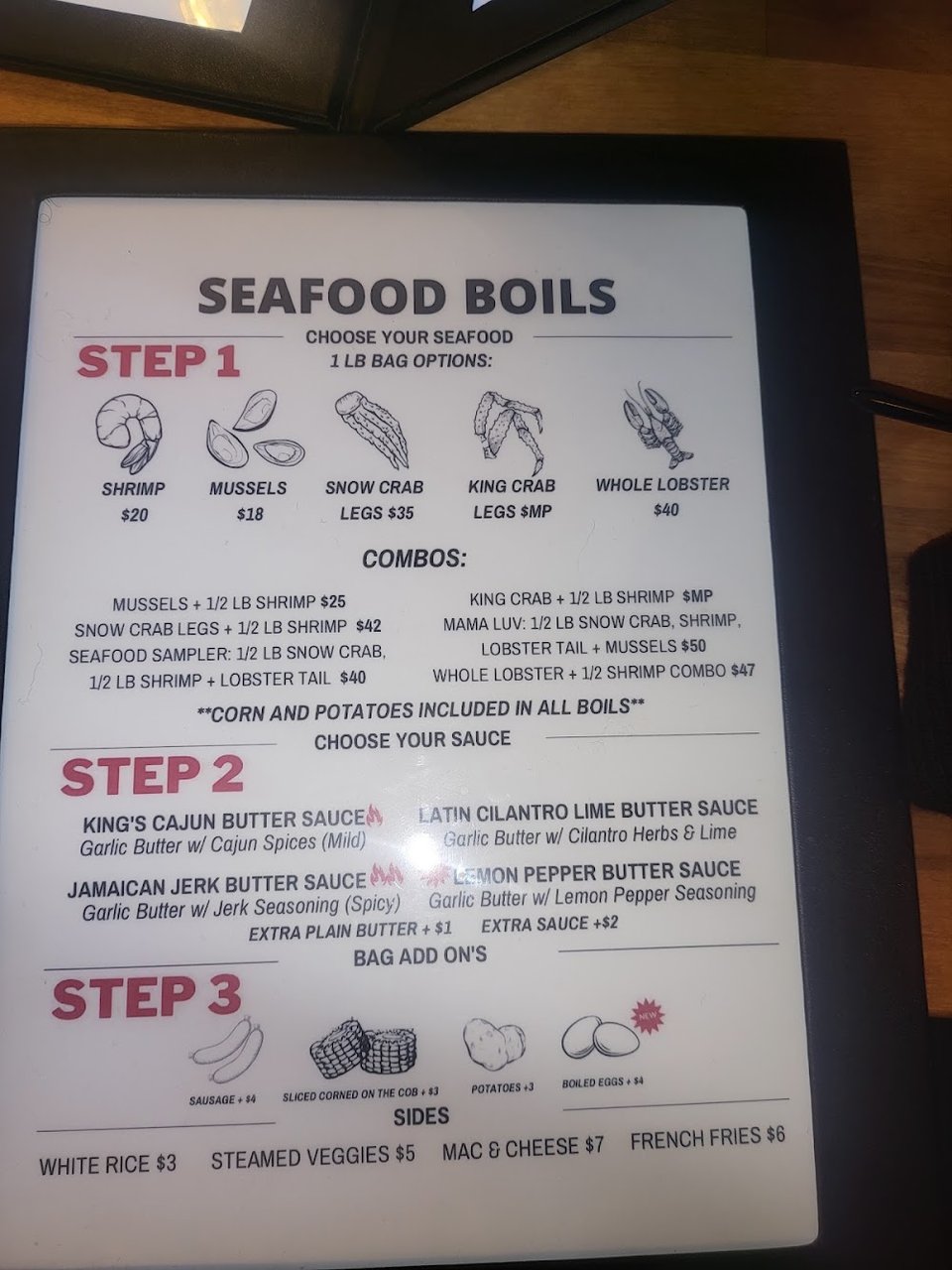 Menu page showing seafood boils and brick oven pizza.